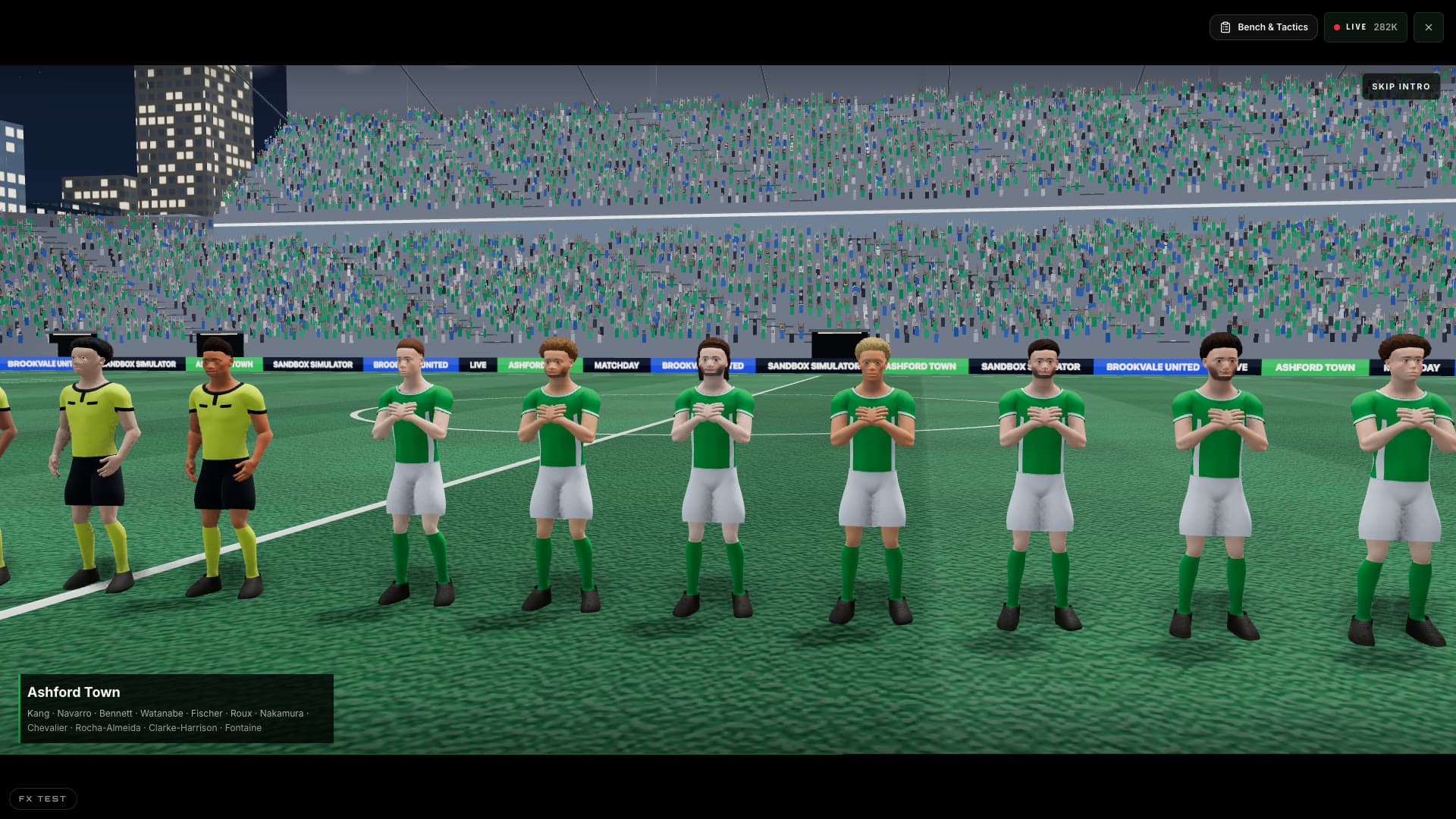 Football players lined up before kickoff in front of a packed stand